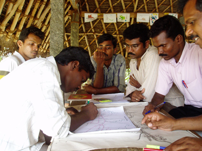 [picture of Village school teachers learning mapping concepts]